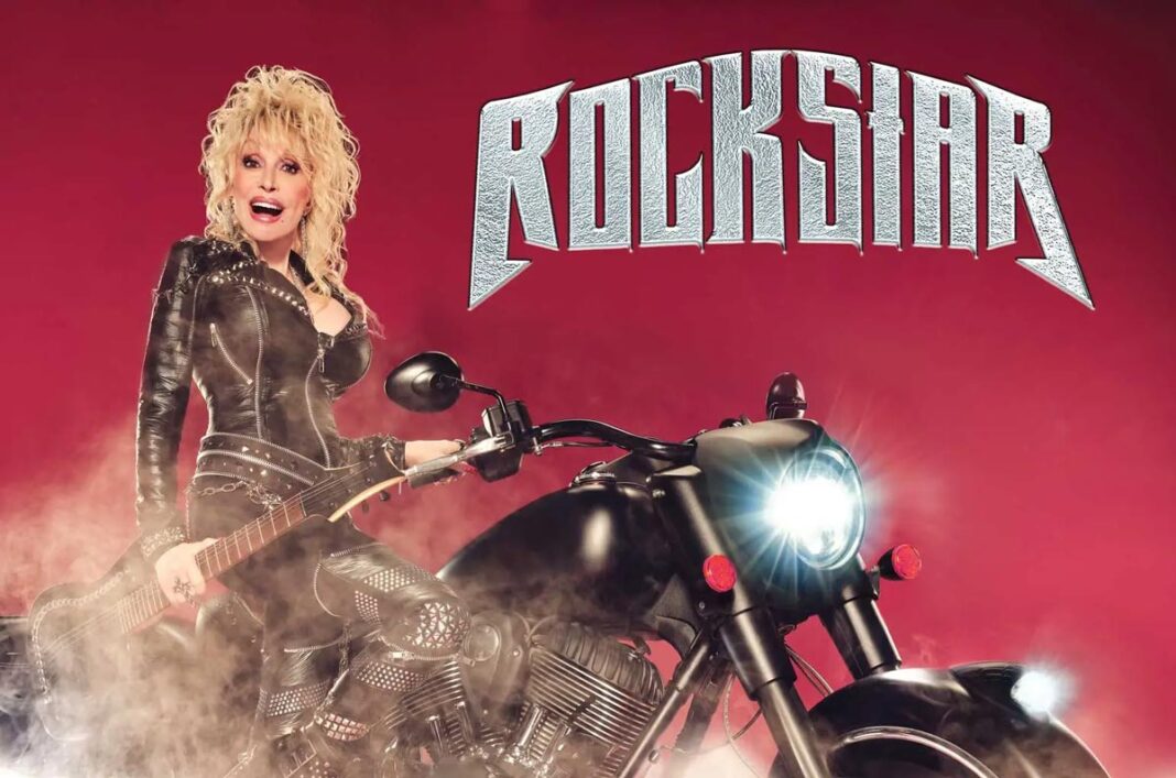 Blonde woman in a studded leather outfit sits on a black motorcycle against a red background with a large 'ROCKSTAR' logo above.